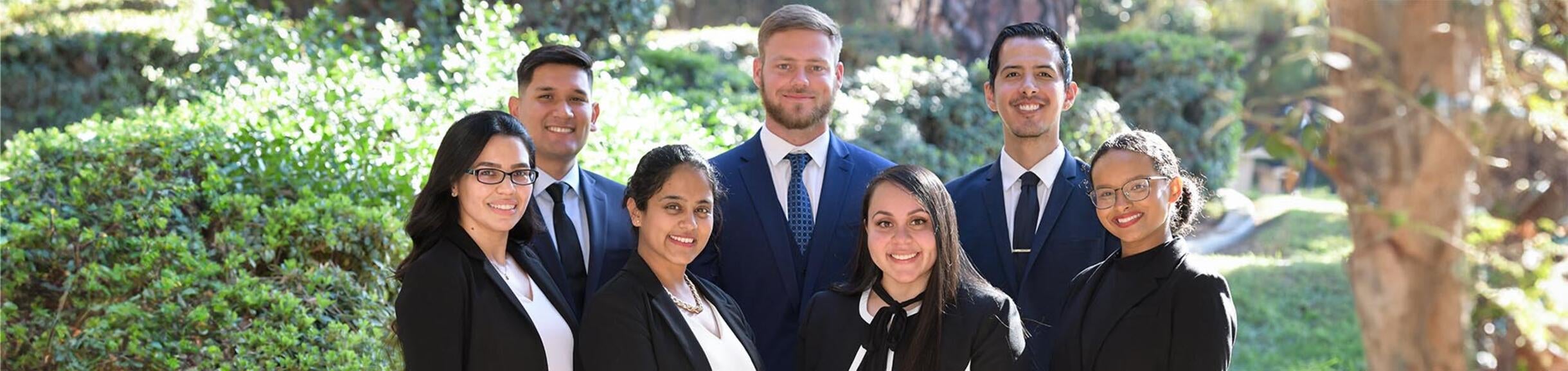 7 graduate students at Anderson Hall, UCR School of Business