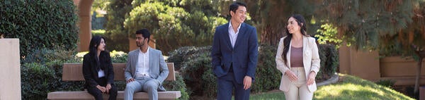 4 graduate students at Anderson Hall, UCR School of Business